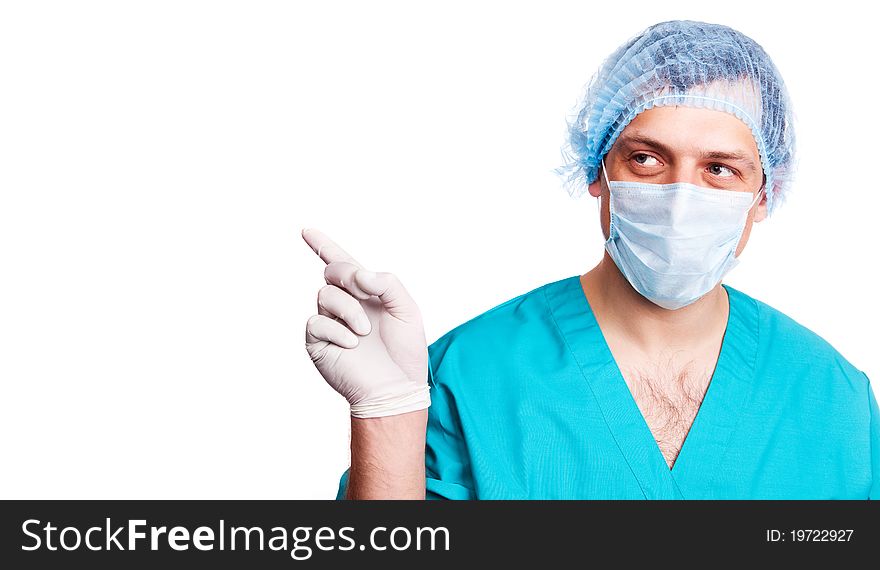 Portrait of a surgeon looking and pointing to the right. isolated on white background, copy space for your text to the right