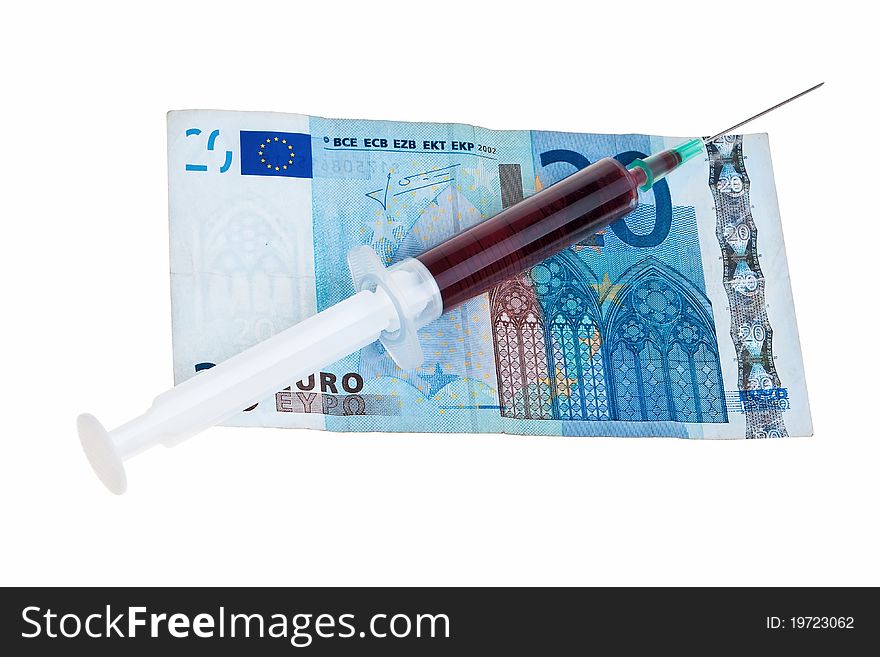 Syringe with red liquid on 20 Euro banknote isolated over white background. Syringe with red liquid on 20 Euro banknote isolated over white background.