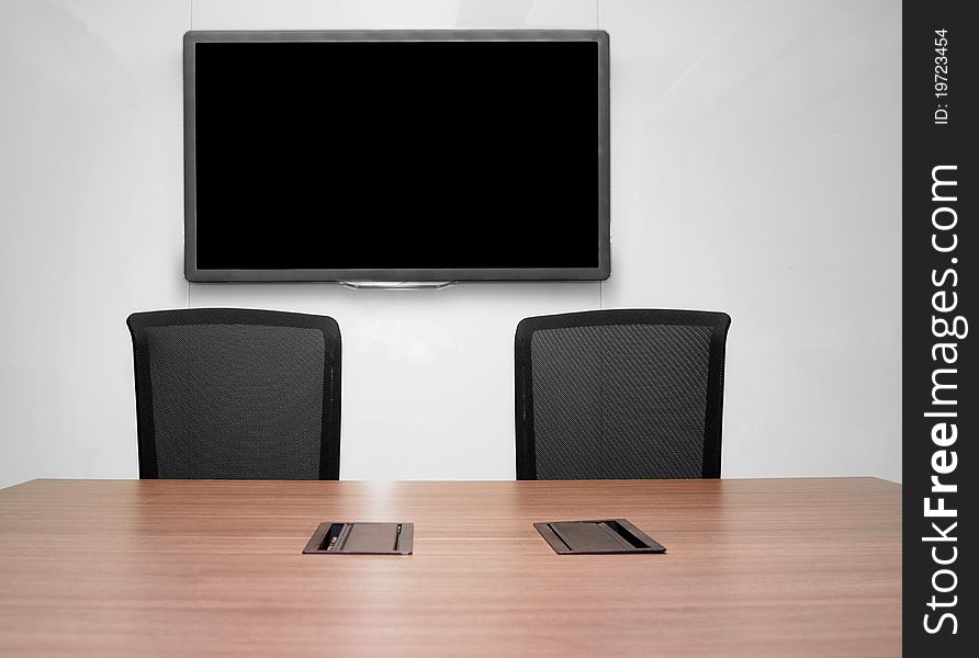 Business meeting room with wooden table and seats. Business meeting room with wooden table and seats.