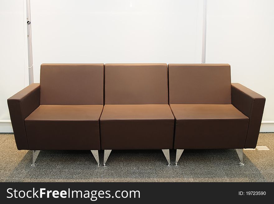 Brown leather couch on a carpet. Brown leather couch on a carpet.