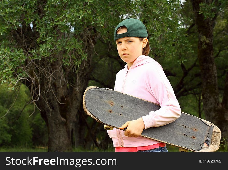 Cut Young Girl With Well Used Scateboard