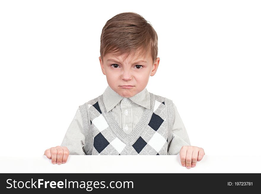 Offended little boy holding empty white board. Offended little boy holding empty white board