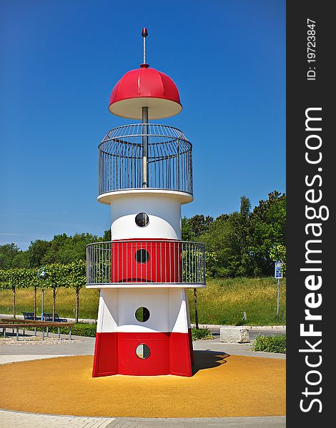 A miniature lighthouse on a playground in Germany.