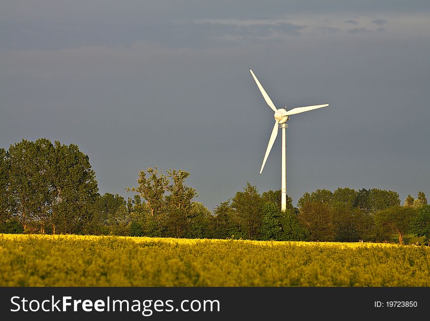 A windmill in a field.