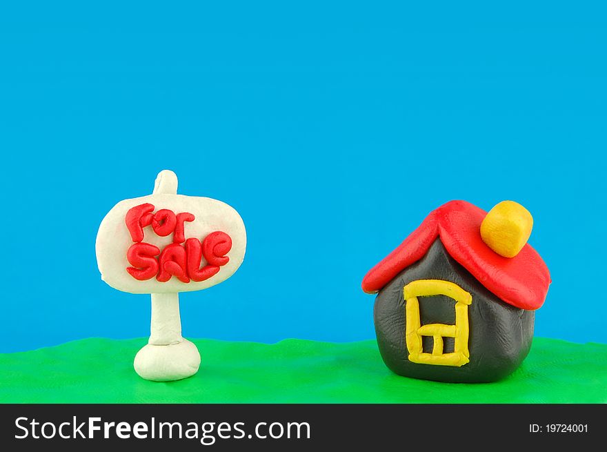 Plasticine house and For Sale sign