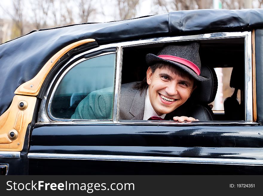 Smile happy groom in retro car. Smile happy groom in retro car