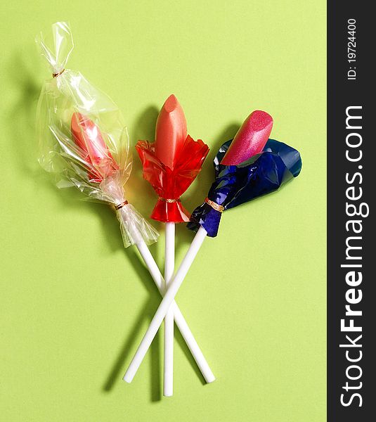 Lollipops made from lipstick, conceptual photo. Studio photo.