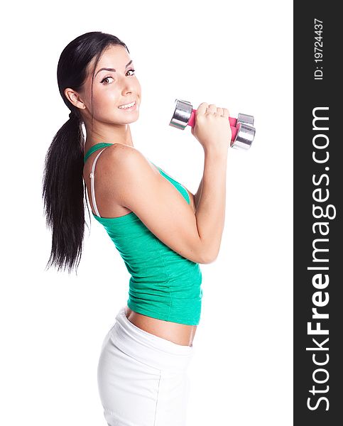 Beautiful young  woman with dumbbells, isolated against white background