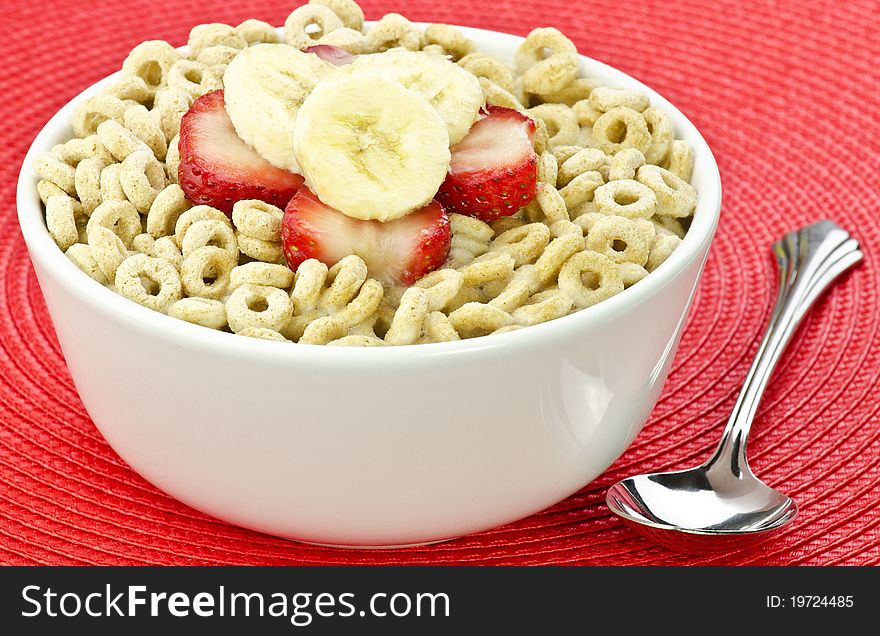A bowl of healthy oat cereal and fruit. A bowl of healthy oat cereal and fruit