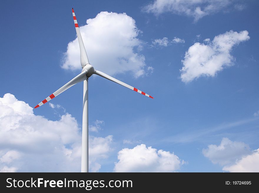 Wind turbine on sunny day in summer