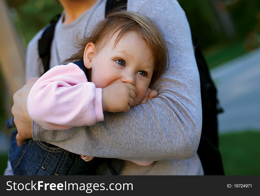 Father holding his baby girl on his arms. Father holding his baby girl on his arms