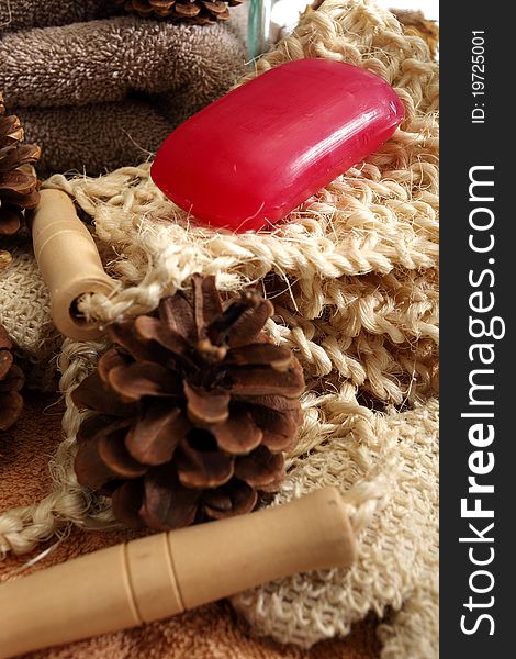 Soap and pine cones placed on a towels and spa accessories. Soap and pine cones placed on a towels and spa accessories