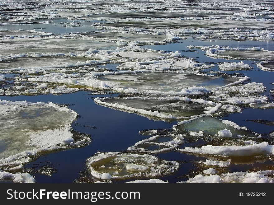 Floating of ice in water in spring background. Floating of ice in water in spring background