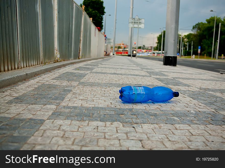 Wasted PET Bottle On Sidewalk