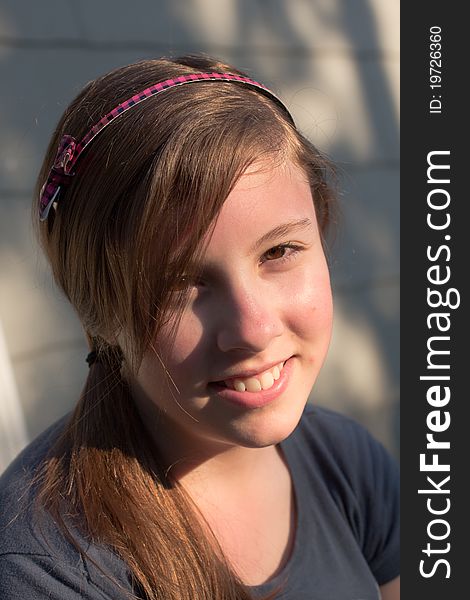 A nice portrait of a cute teenage girl in the evening sun. A nice portrait of a cute teenage girl in the evening sun