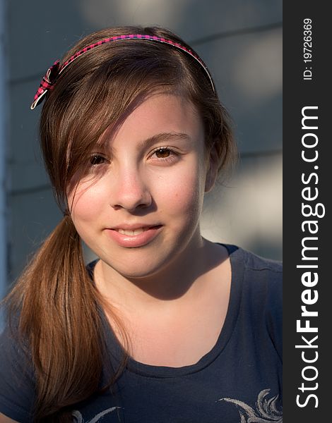 A nice portrait of a cute teenage girl in the evening sun. A nice portrait of a cute teenage girl in the evening sun