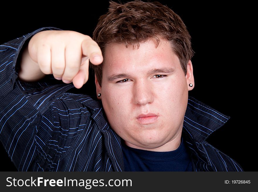 Young Man In A Blue Shirt And Pointing