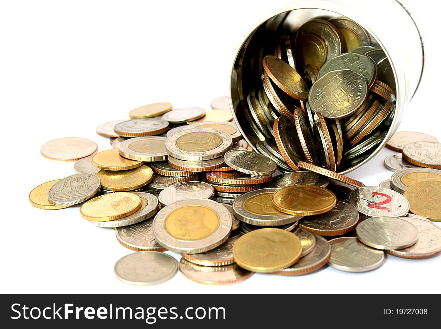 Coins in a tin can . Isolated over white .