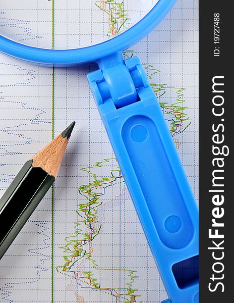 Stock chart statistical chart with a pencil and magnifier, shown as analysis for stock or currency marketing and trend, or related business and finance concept. Stock chart statistical chart with a pencil and magnifier, shown as analysis for stock or currency marketing and trend, or related business and finance concept.