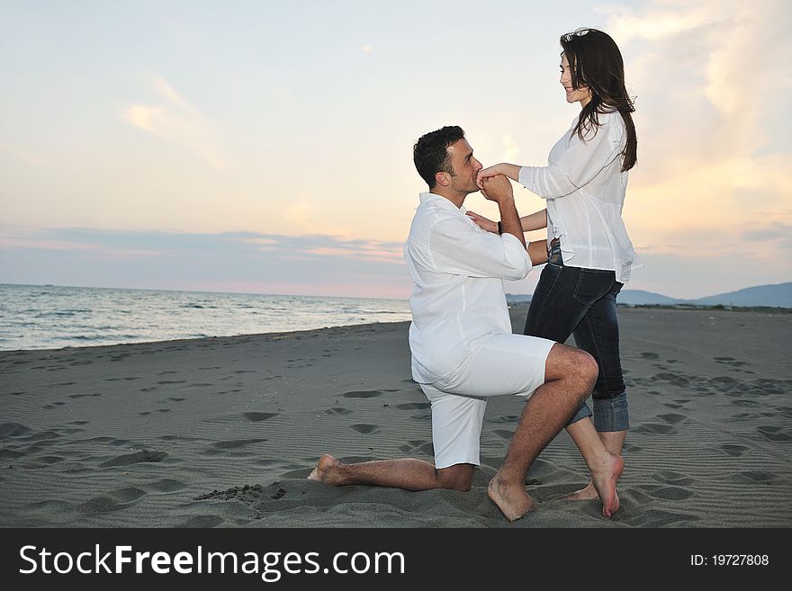 Happy Young Couple Have Fun On Beach