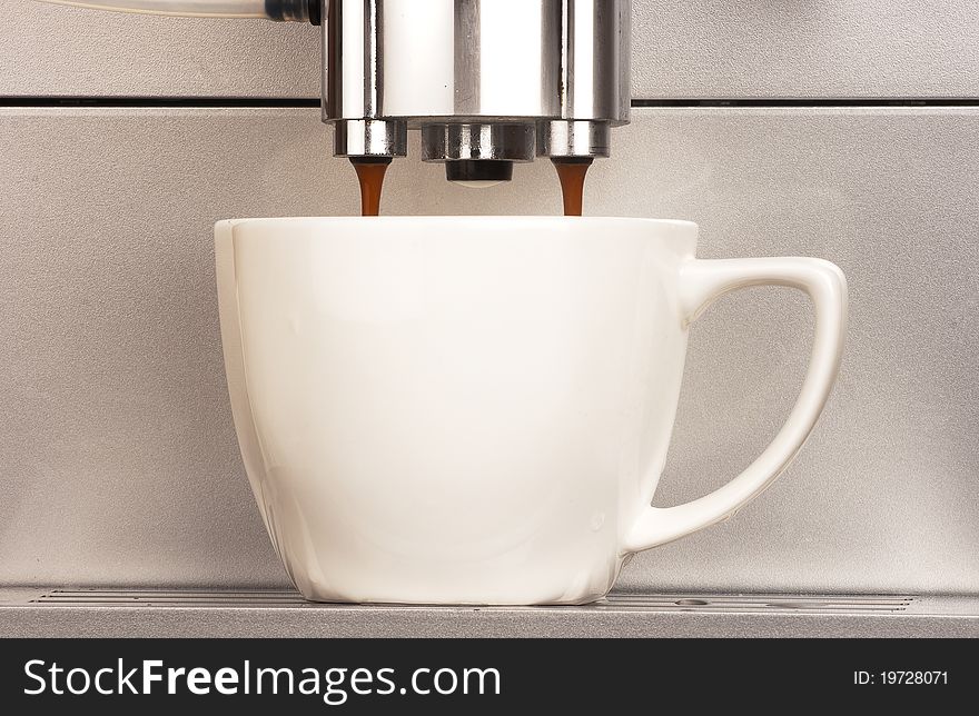 Co0ffee machine with cup of coffee