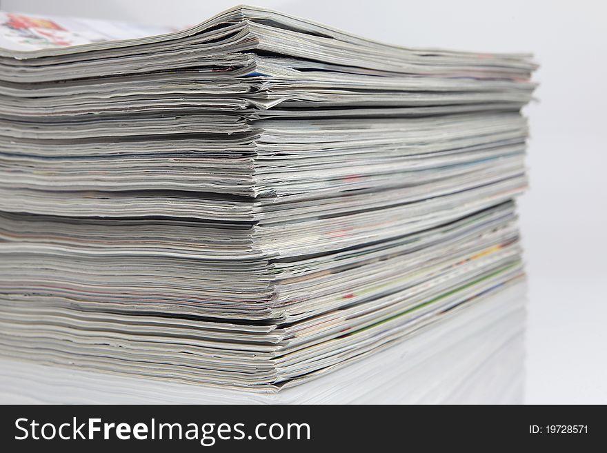 Stack of magazines with reflections