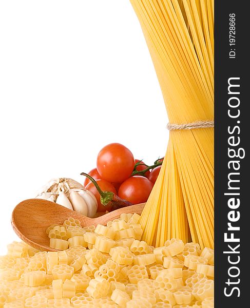 Raw pasta and wooden spoon isolated