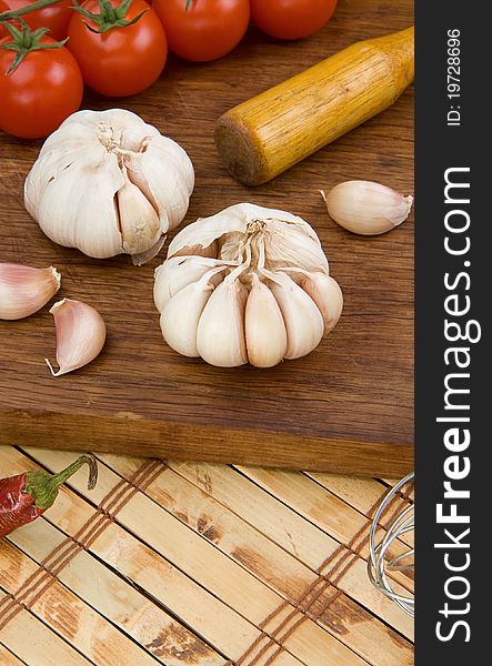 Set of garlic nutrition and healthy food on wooden texture