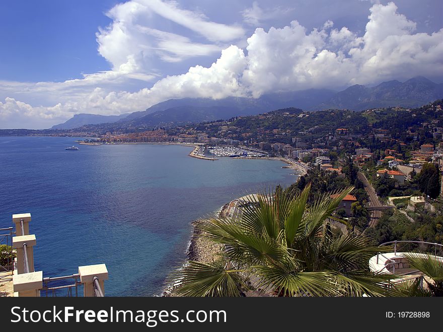 Sunny Riviera coastline with views of the city