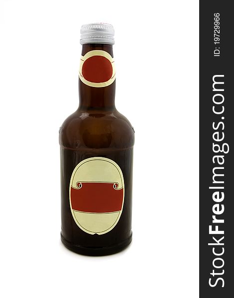 Brown bottle with a blank red label isolated on white. Brown bottle with a blank red label isolated on white
