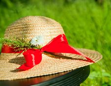 Straw Hat With Red Ribbon In The Grass Royalty Free Stock Image Straw Hat With Red Ribbon In The Grass Royalty Free Stock Image