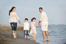 Happy Young Family Have Fun On Beach At Sunset Royalty Free Stock Photography Happy Young Family Have Fun On Beach At Sunset Royalty Free Stock Photography