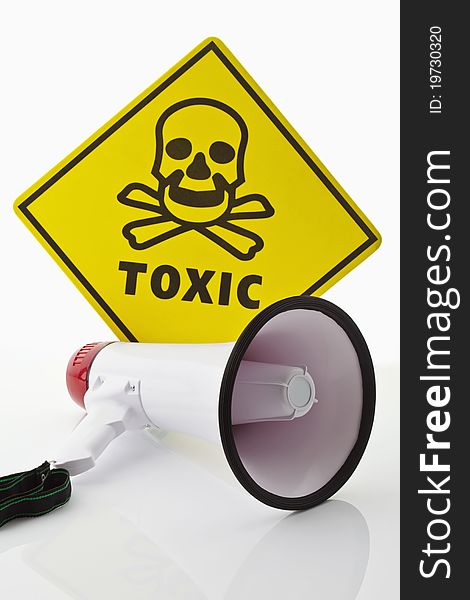 A toxic caution label and a megaphone on white background. A toxic caution label and a megaphone on white background