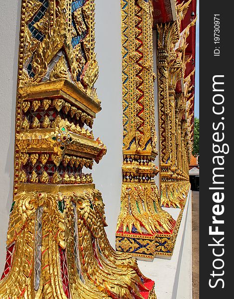 Gold columns of Thai temple in Bangkok.