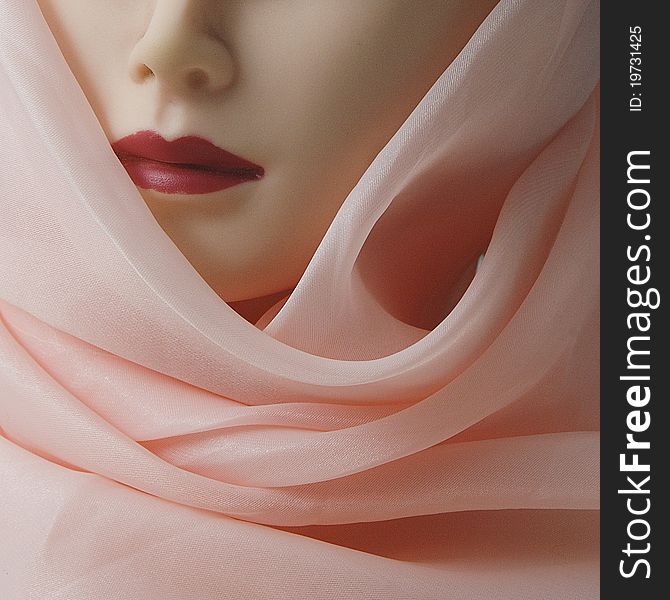 A women model is in pink scarf