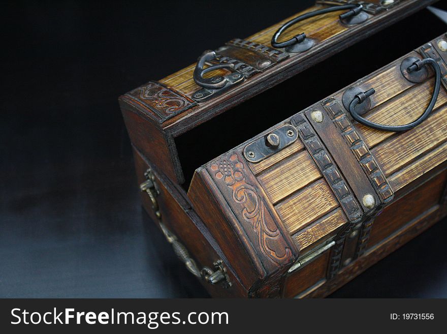 A close-up on an open antique wooden box. A close-up on an open antique wooden box.