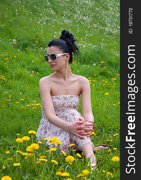 A young girl rests in a park