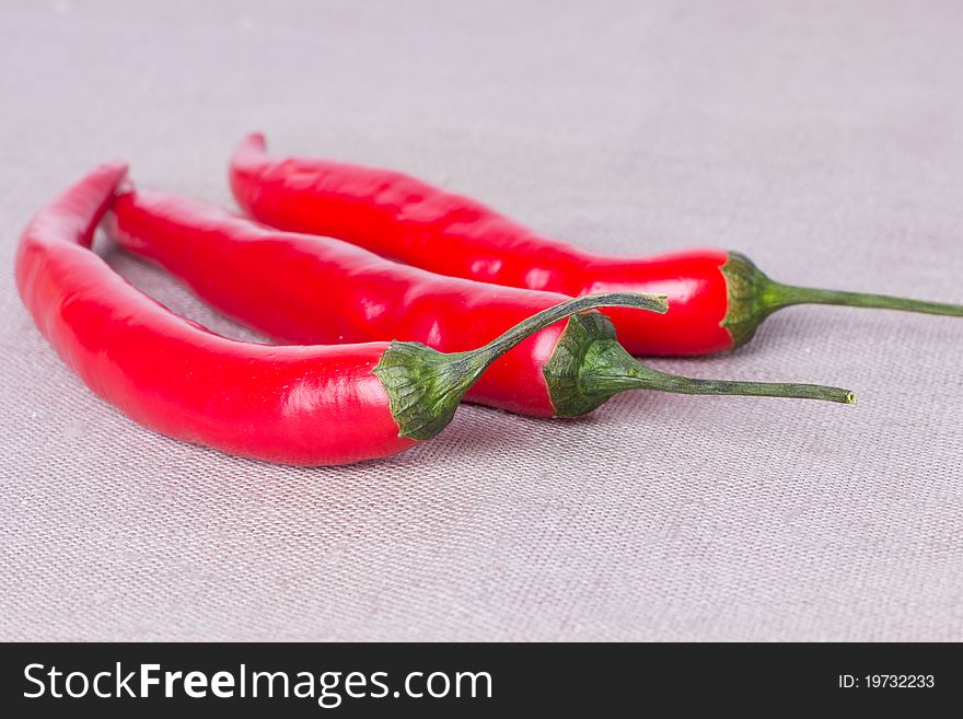 Three peppers on the fabric