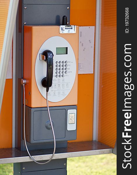 Lonely Orange Public Telephone in Thailand