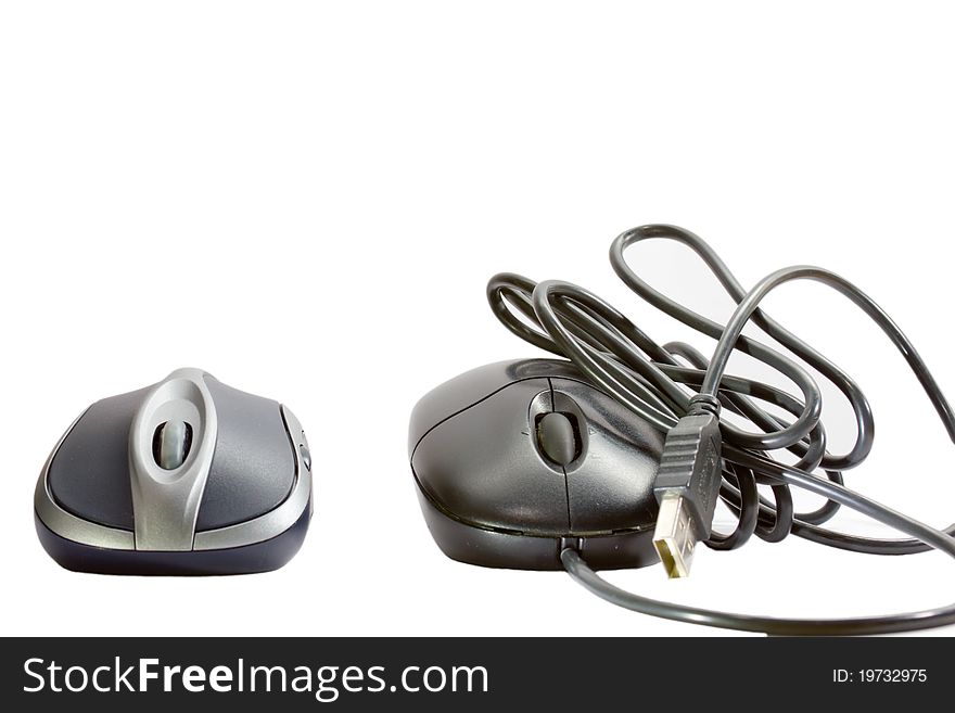 An easy to use wireless mouse and an annoying cable mouse (isolated on white with path). An easy to use wireless mouse and an annoying cable mouse (isolated on white with path).
