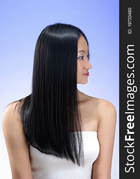 Portrait of beautiful young woman with long straight black hair. Portrait of beautiful young woman with long straight black hair