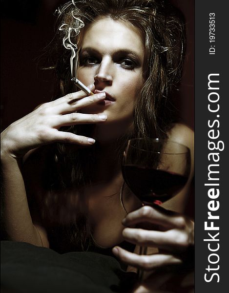 Girl with wineglass and cigarette