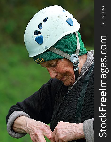 The elderly happy woman-climber