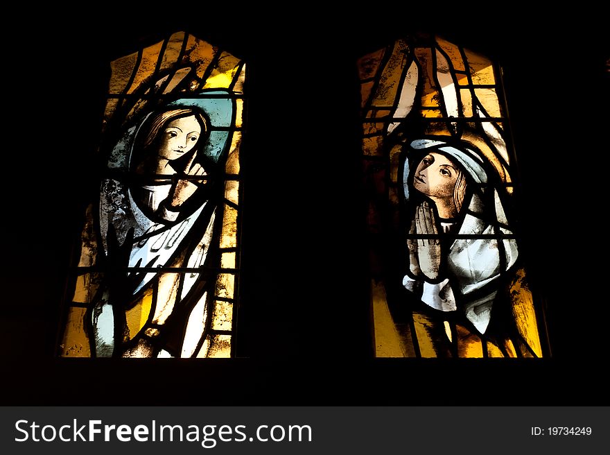 Stained glass windows in the Catholic Church of the Annunciation depict the Archangel Gabriel and Mary.