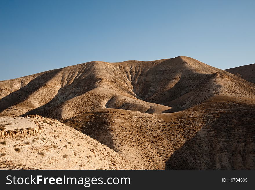 Desert hillsides near Wadi Qelt in the West Bank Jordan Valley desert. Desert hillsides near Wadi Qelt in the West Bank Jordan Valley desert.