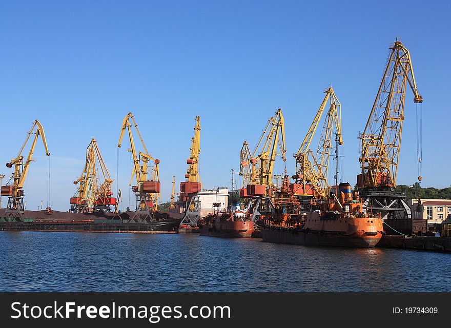 Cranes in a port, unloading ships