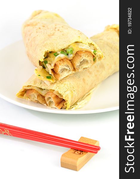 Traditional Chinese breakfast pancakes with red chopsticks. Traditional Chinese breakfast pancakes with red chopsticks.