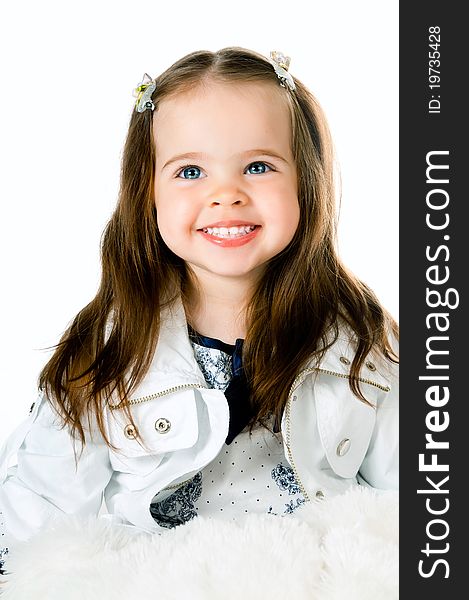 Cute little girl in studio on white background