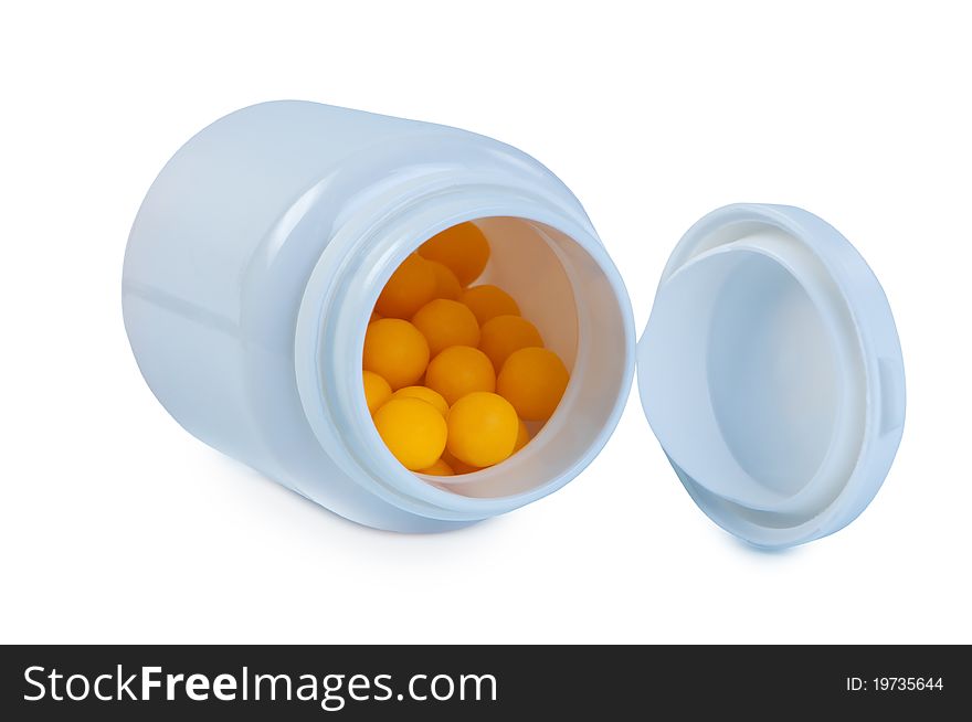 Tablets in a plastic jar isolated.
