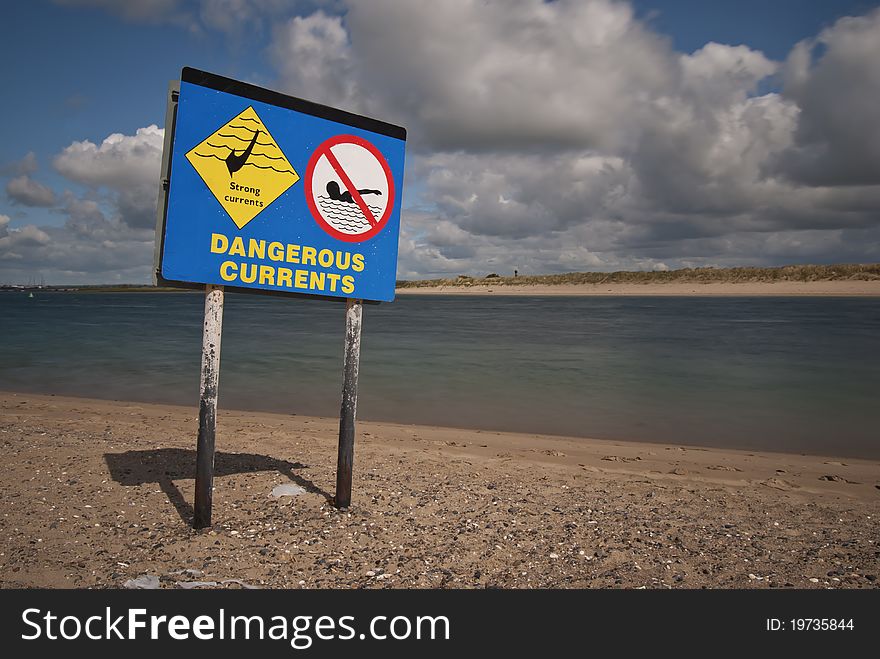 Dangerous currents beach sign with no swimming sign. Dangerous currents beach sign with no swimming sign